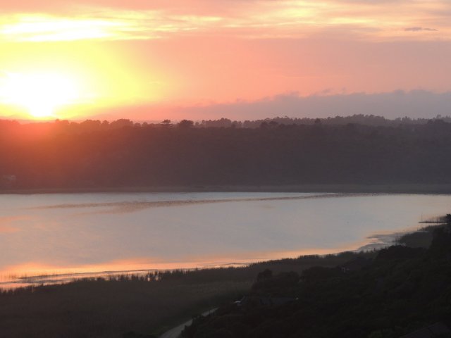 Sunrise over island lake